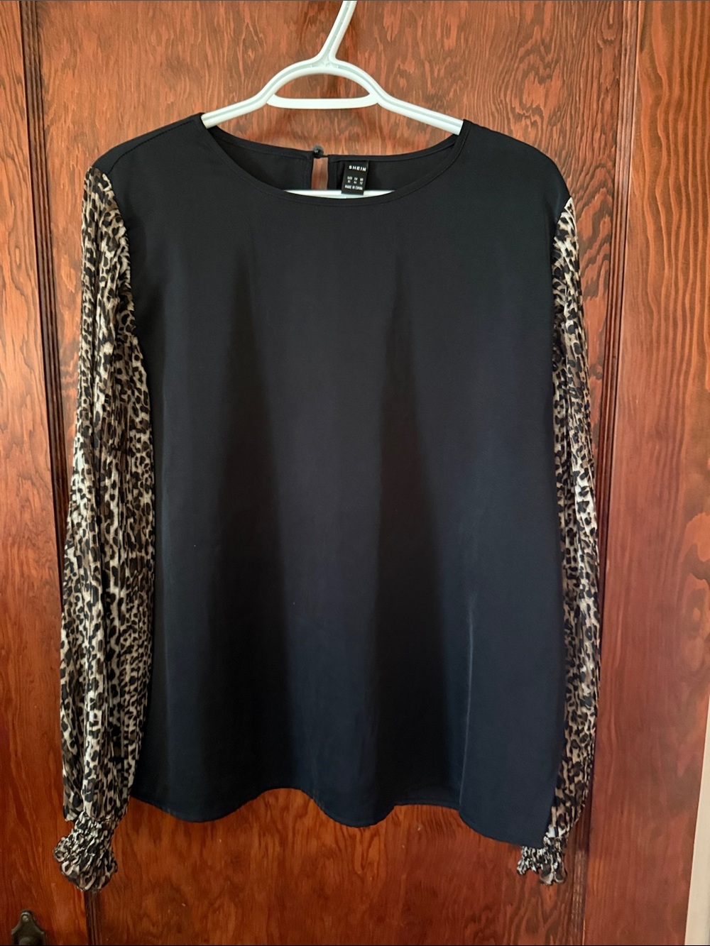 SHEIN Black Top with Leopard-Print Sheer Sleeves